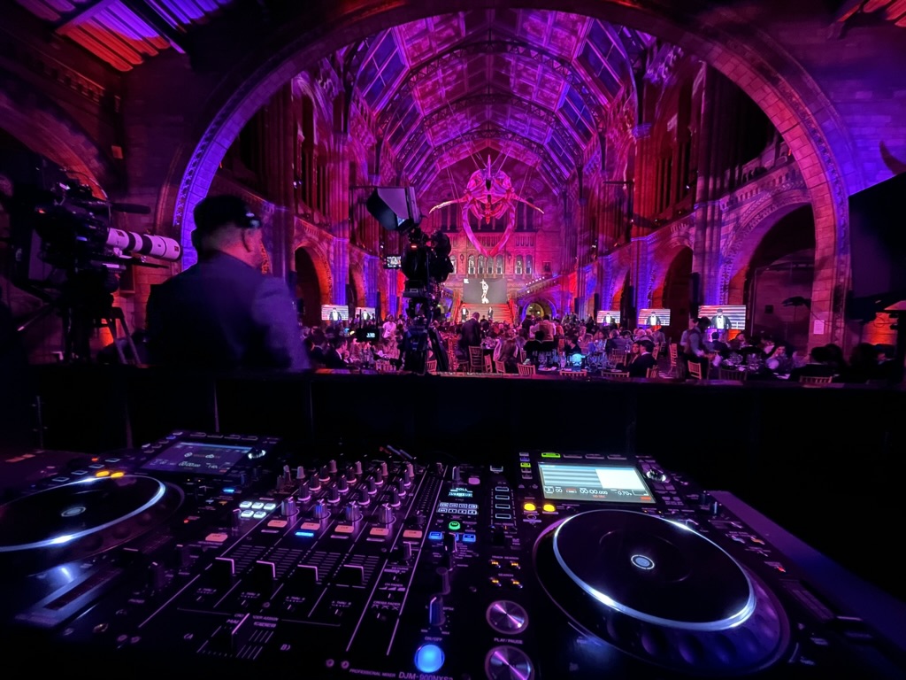 Event production in the illuminated main hall at the Natural History Museum